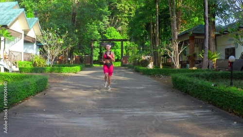 Wallpaper Mural Aerial view on Healthy woman run and workout on outdoor park. Asian runner people exercise with fitness session, nature park background. Health and Lifestyle Concept. Generative AI Torontodigital.ca