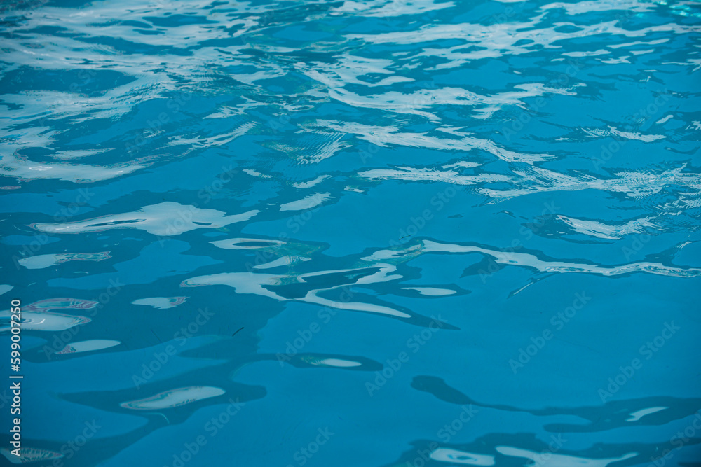 Ripple Water in swimming pool with sun reflection. Wavy water background. Ripple Water in swimming pool with sun reflection. Wavy water background.
