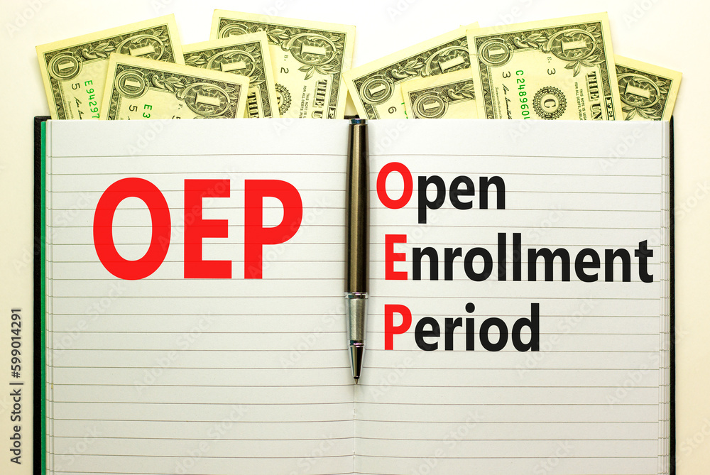 OEP symbol. Concept words OEP Open enrollment period on beautiful white note. Dollar bills. Beautiful white table white background. Medical and OEP Open enrollment period concept. Copy space. OEP symbol. Concept words OEP Open enrollment period on beautiful white note. Dollar bills. Beautiful white table white background. Medical and OEP Open enrollment period concept. Copy space.