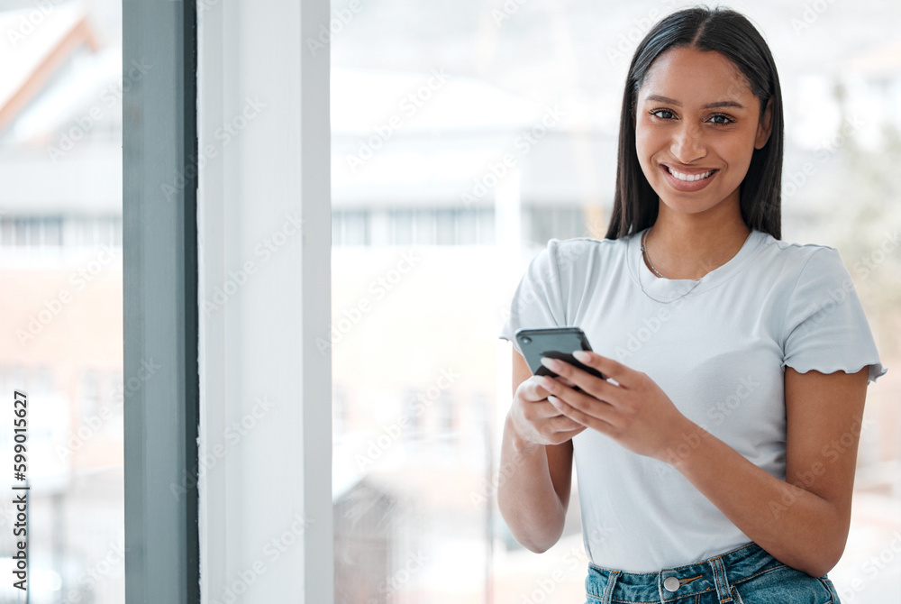 I think a house warming party is in order. an attractive young woman standing alone at home and using her cellphone. I think a house warming party is in order. an attractive young woman standing alone at home and using her cellphone.
