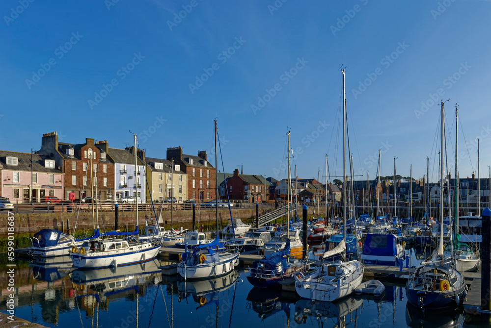 Yachts and Pleasure Craft moored up in the new Marina with floating Pontoons at Arbroath Harbour on a fine Summers morning.
