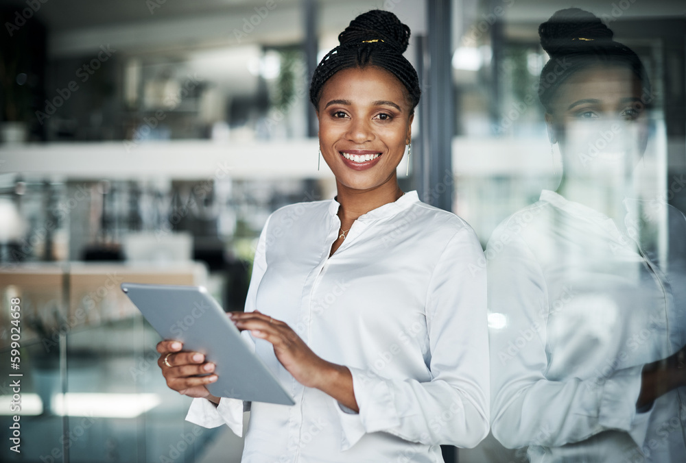 This office is my empire. an attractive young businesswoman standing alone in the office and using a digital tablet during the day. This office is my empire. an attractive young businesswoman standing alone in the office and using a digital tablet during the day.