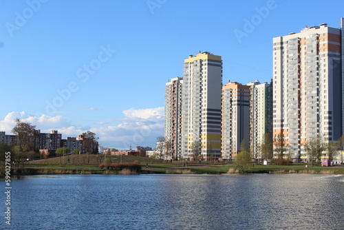 downtown Sankt Petersburg city russia panorama landmark against blue sky background. Modern residential building and park with duck pond urban street landscape view. Summer in city