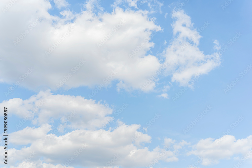 White clouds on a blue sky background. White clouds on a blue sky background.