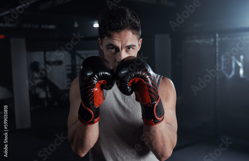 Prepare to be overpowered. Portrait of a young man practicing his boxing routine at a gym. © A. Frank/peopleimages.com