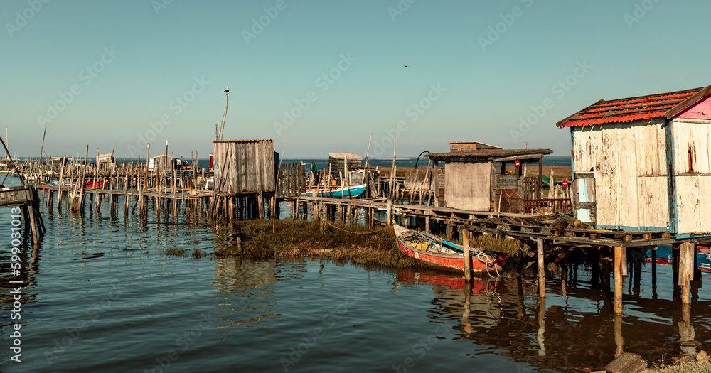 Wooden walkways and huts of the Cais de Palafitas da Carrasqueira.,Palafitico da Carrasqueira Pier in  Comporta Portugal
Europe Travel Portugal Alentejo beautiful Destinations