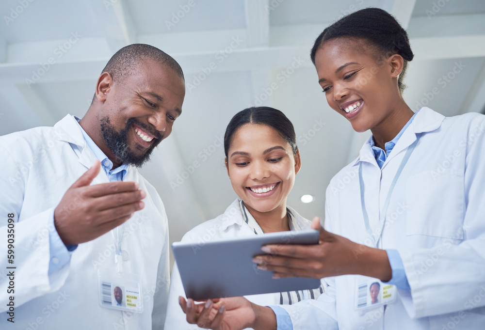 Fototapeta premium Banding together to bring about change. a group of scientists using a digital tablet in a laboratory.