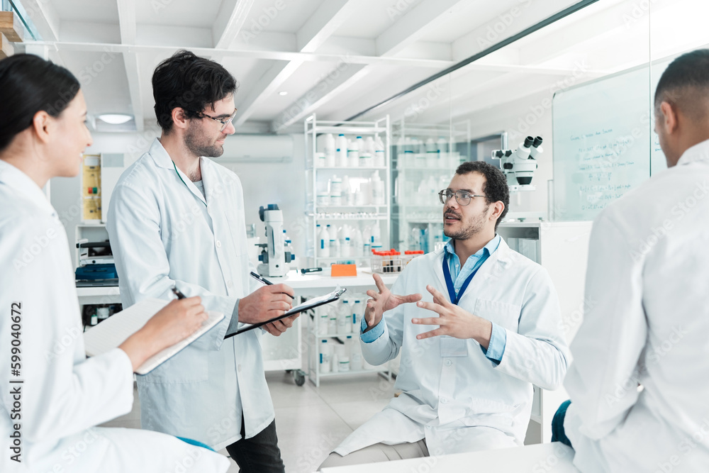 We have to stick to the facts. a group of scientists working together in a lab.