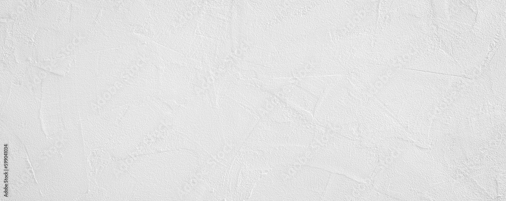 White rough grainy stone or plastered wall texture background