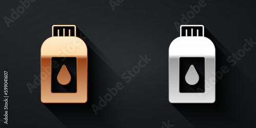 Gold and silver Canister for motor machine oil icon isolated on black background. Oil gallon. Oil change service and repair. Long shadow style. Vector