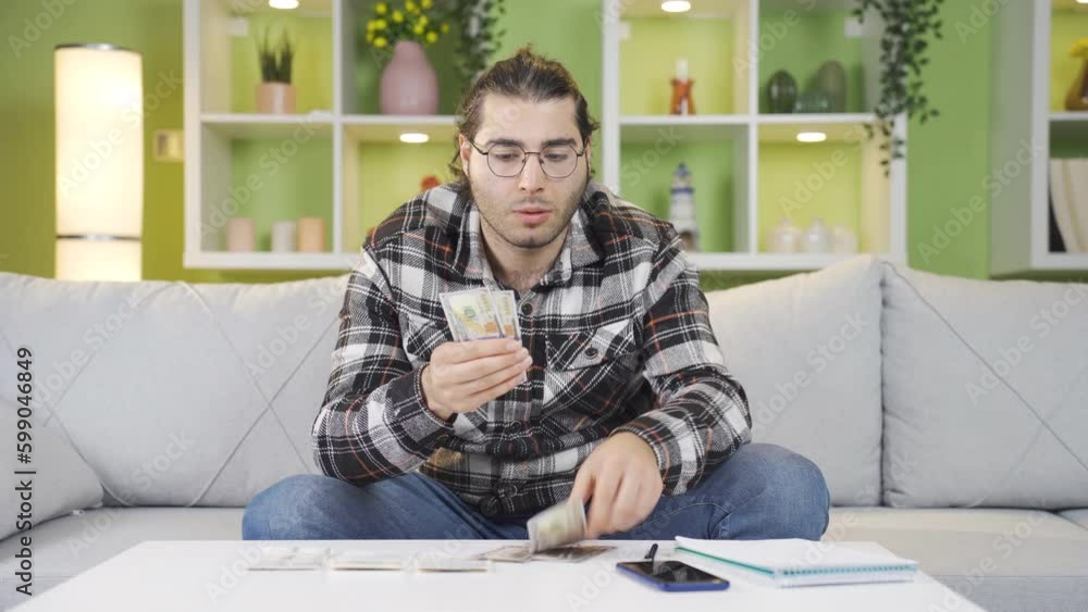 Young man calculating household budget. Young man calculating household budget.