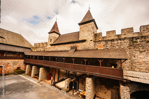 Castle Sovinec, Eulenburg, robust medieval fortress, one of the largest in Moravia, Czech republic. landscape with medieval castle on a rocky hill above a forest valley photo