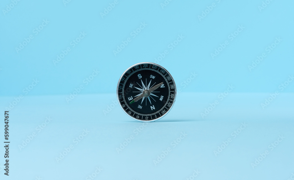Round compass on a blue background