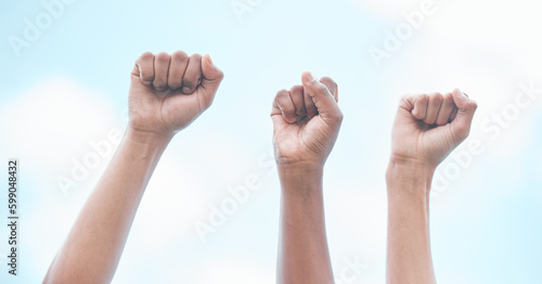 Here to do what needs to be done. Cape Town, South African - October 2, 2021 Unrecognisable demonstrators holding up their fists in protest.