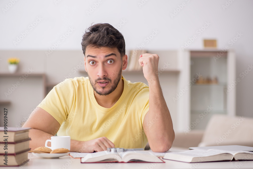 Young male student studying at home Young male student studying at home