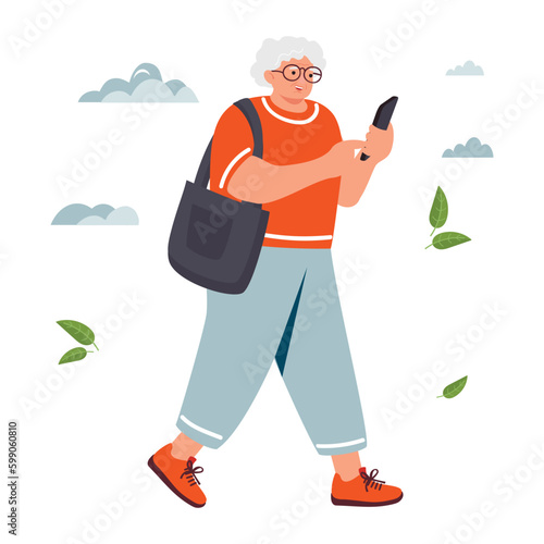 Walking elderly woman uses a smartphone.Smiling white-haired female character communicates online.Grandmother with glasses and with a bag.Vector cartoon flat style illustration on white background.