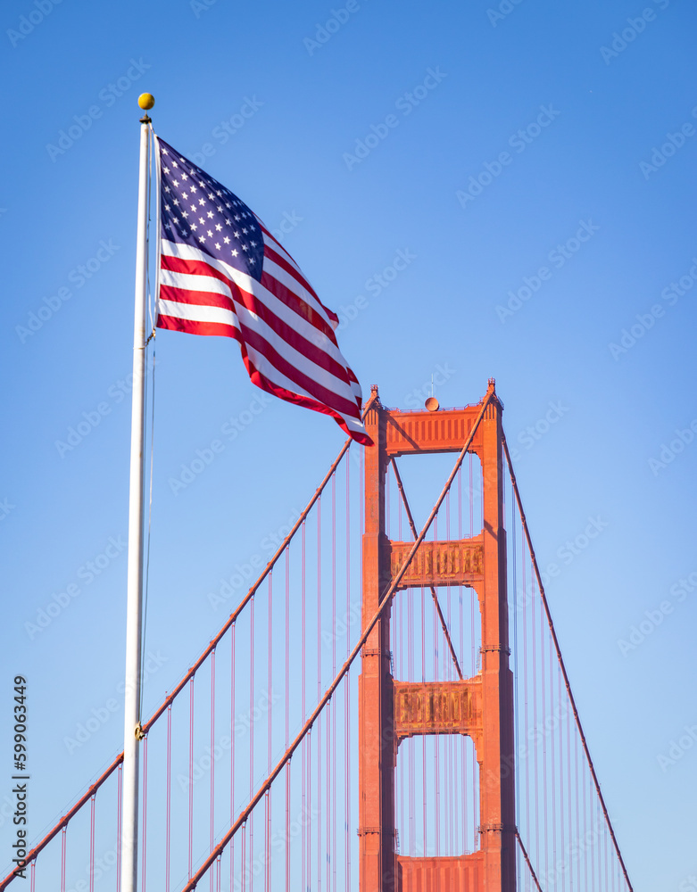 Fototapeta premium Golden Gate Bridge Tower and American Flag
