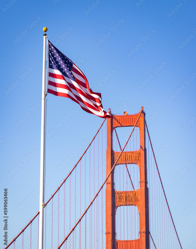 Fototapeta premium Golden Gate Bridge Tower and American Flag