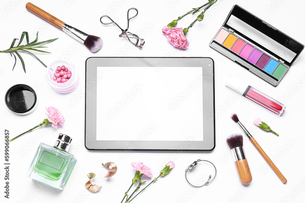 Composition with modern tablet computer, cosmetics, accessories and carnation flowers on white background Composition with modern tablet computer, cosmetics, accessories and carnation flowers on white background