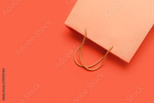 Empty paper bag on color ba...