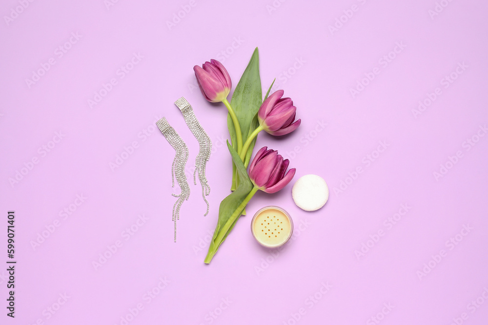 Composition with beautiful earrings, makeup powder and tulip flowers on lilac background