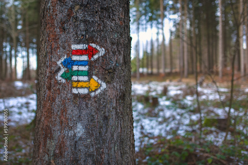 Red, blue, green and yellow direction signs of the Czech Hiking Markers System. This system spread through Central Europe and Eastern Europe and even to countries outside Europe.