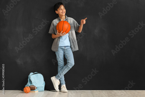 Little boy with ball pointi...