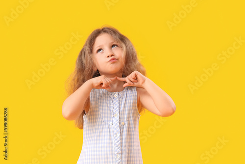 Dreaming little girl on yel...