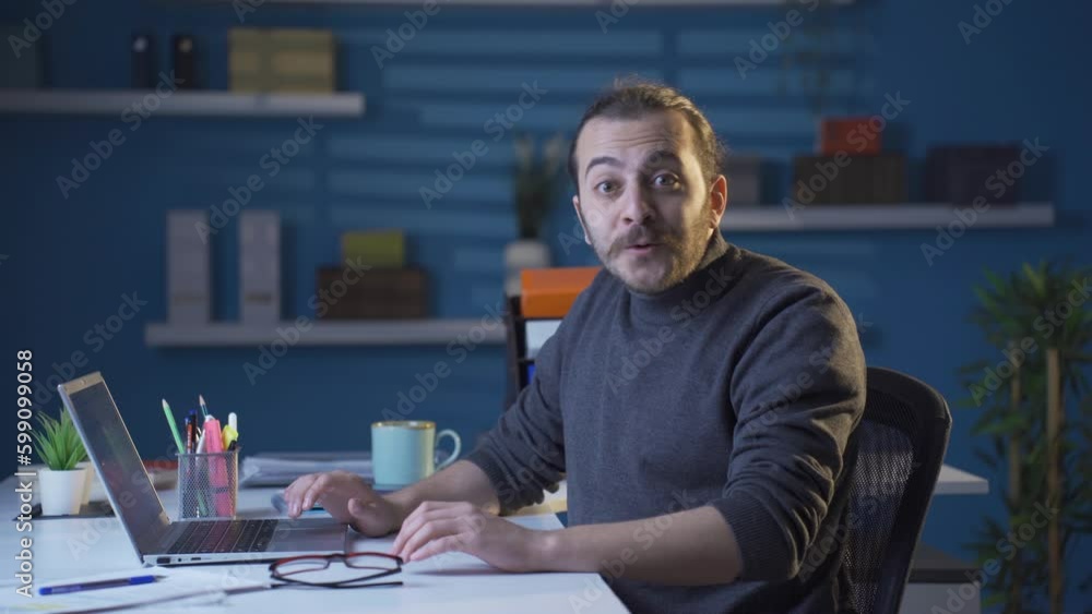 Confused home office worker looks at camera. Confused home office worker looks at camera.