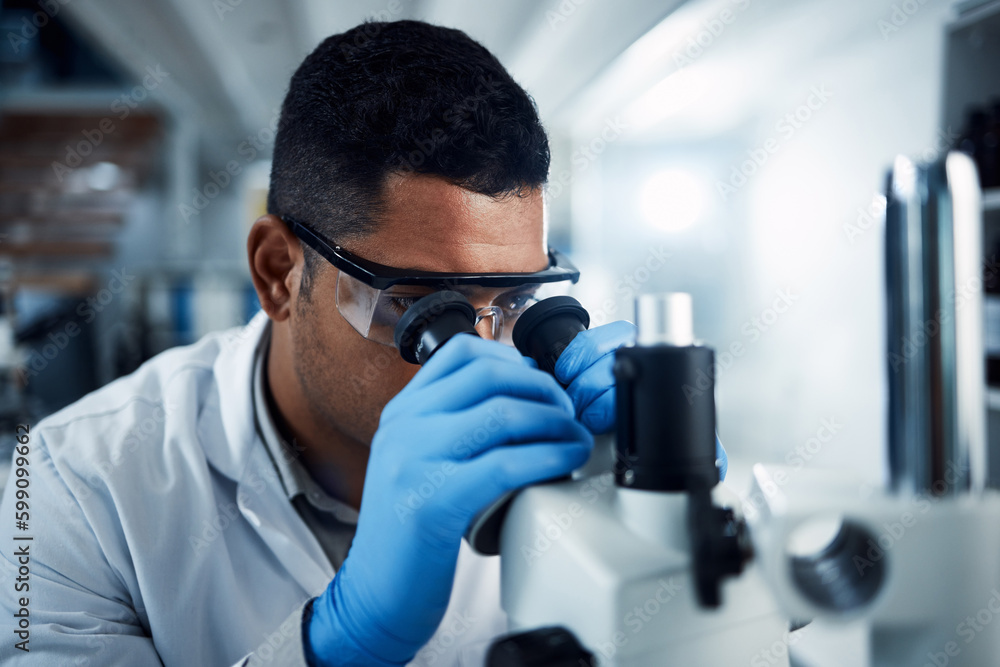 You can run but you cant hide. a young scientist using a microscope in a laboratory. You can run but you cant hide. a young scientist using a microscope in a laboratory.
