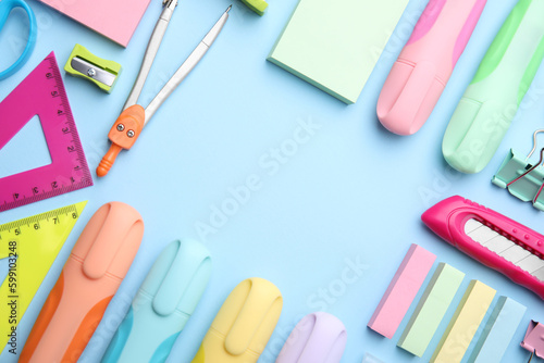 Frame of different school stationery on light blue background, flat lay. Back to school