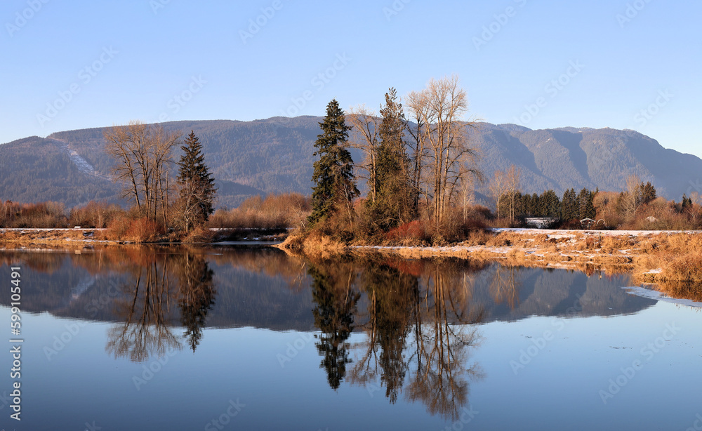 Early winter scenery reflected in the water surface Early winter scenery reflected in the water surface