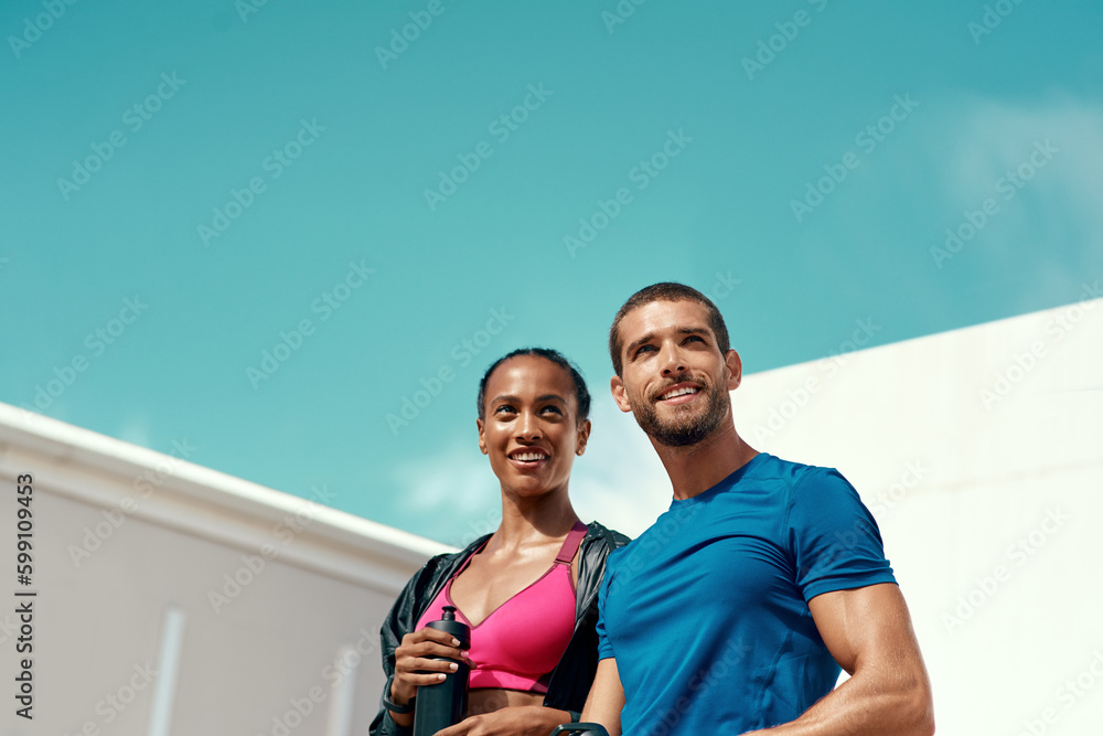 © Emil Lime/peopleimages.com - Whatever you think is impossible, is possible. two sporty young people standing together.