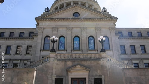 Mississippi State Capitol building in Jackson, Mississippi with tilt up from benches. photo