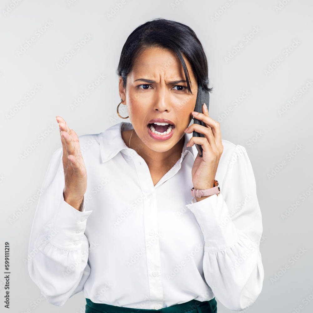 I said sell when it goes up. Studio shot of a young businesswoman using a smartphone and yelling against a grey background. I said sell when it goes up. Studio shot of a young businesswoman using a smartphone and yelling against a grey background.