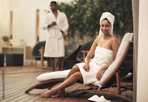 Youd be amazed at how beneficial a spa day can be. a woman wearing a towel around her head while enjoying a spa day. photo