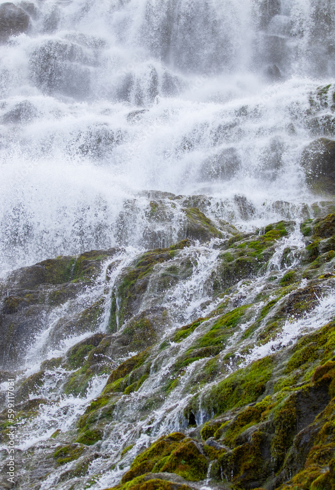 Dynjandi Waterfall Water Texture. Beautiful Pure Nature in Iceland. Powerful Mountain River Background. Huge Water Stream, Infinite Natural Energy. Travel Europe. Go Everywhere. High quality photo.