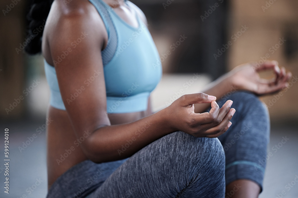 Its time to get your zen on. an unrecognizable woman meditating.