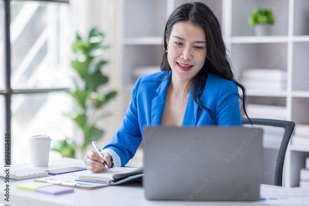 Business asian woman working at office with documents on his desk, doing planning analyzing the financial report, business plan investment, finance analysis concept Business asian woman working at office with documents on his desk, doing planning analyzing the financial report, business plan investment, finance analysis concept