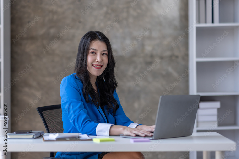 © David - Business asian woman working at office with documents on his desk, doing planning analyzing the financial report, business plan investment, finance analysis concept © David - Business asian woman working at office with documents on his desk, doing planning analyzing the financial report, business plan investment, finance analysis concept