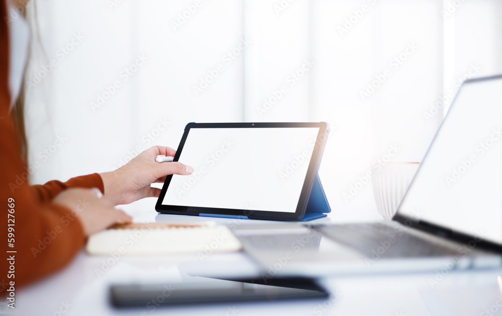 Asian teenage woman study online class at home or cafe by using tablet and laptop, video call with teacher and friends learning, university student studying online concept Asian teenage woman study online class at home or cafe by using tablet and laptop, video call with teacher and friends learning, university student studying online concept