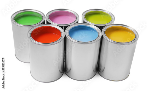 Cans of different paints on white background