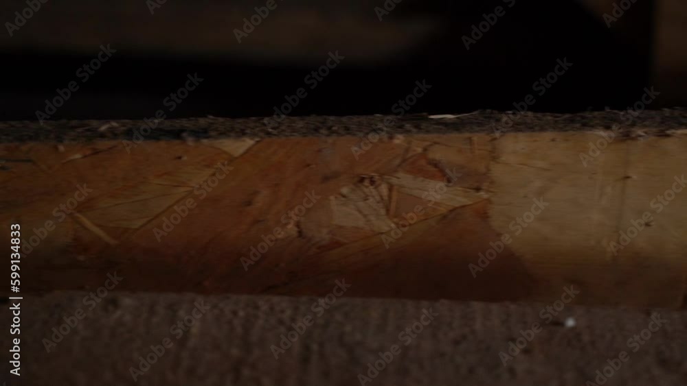Osb panel close-up in the dark, smooth camera movement Osb panel close-up in the dark, smooth camera movement