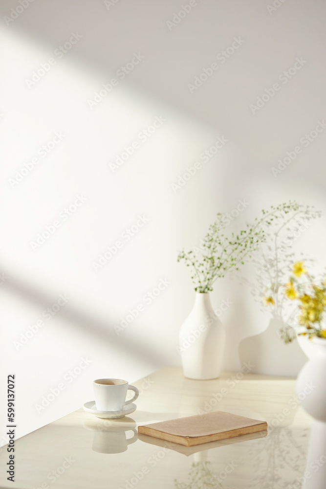Vases and objects on the table in a warm room with sunlight coming in Vases and objects on the table in a warm room with sunlight coming in