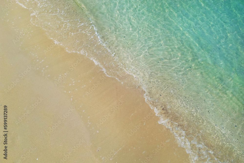 aerial view with drone ,of waves on tropical white sand beach 