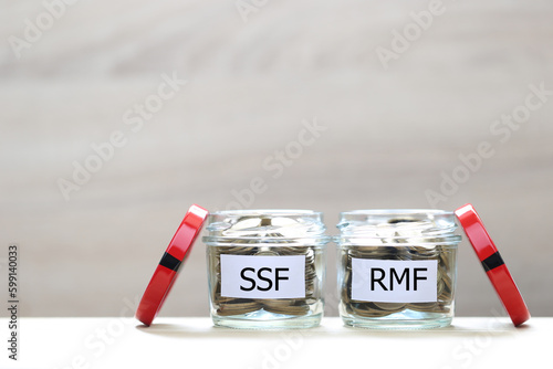 Retirement Mutual Fund, Coins money in the glass bottle on white background, Save money for prepare in future and pension retirement concept