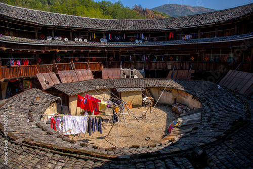 CHUXI TULOU CLUSTER, FUJIAN, CHINA. FEBRUARY 17th, 2021: Inside Chuxi Tulou Cluster in the early morning. Tulou is the unique traditional rural dwelling of Hakka. photo