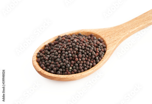 pile of black mustard seed in wood spoon isolated on background. heap of black mustard seed in spoon isolated on background. black mustard seed spoon isolated                          