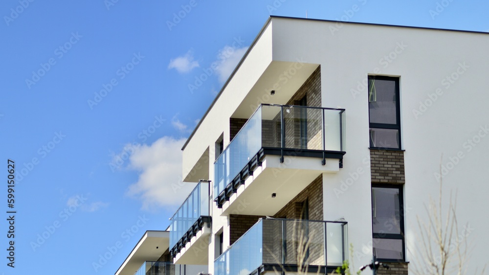 Modern apartment buildings on a sunny day with a blue sky. Facade of a modern apartment building. Contemporary residential building exterior in the daylight. 