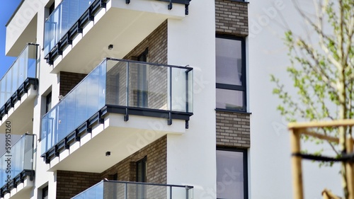 Modern apartment buildings on a sunny day with a blue sky. Facade of a modern apartment building. Contemporary residential building exterior in the daylight. 